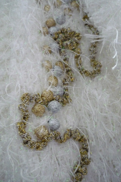 Détail de la veste blanche
